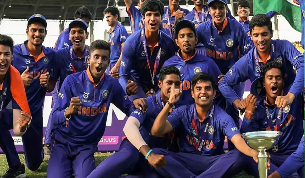 U19 Indian Team Cricket Players Enjoying their Victory with Cup Sitting on Ground